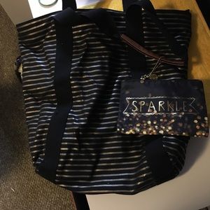 Black and gold striped tote w/ small cosmetic bag